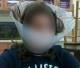 Student wearing plastic cone dog collar (Fox News)