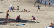 People on beach (Image: ABC News)