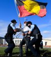 FLag and police (Image: Lukas Coch/AAP, The Conversation)